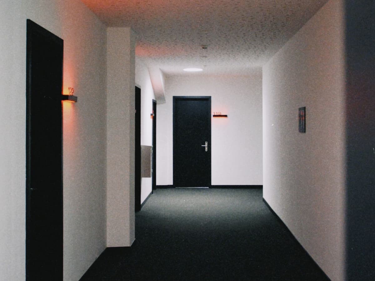 Technician and building manager in a condo mechanical room