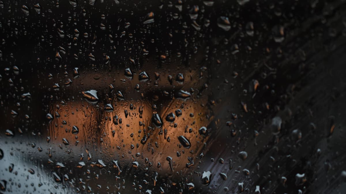Rain on the window of a warm Vancouver living room